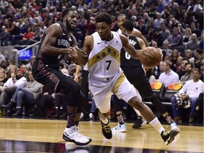 Toronto Raptors guard Kyle Lowry (7) moves around Brooklyn Nets forward DeMarre Carroll (9) during second half NBA basketball action in Toronto on Jan. 11, 2019.