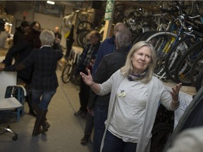 Lori Newton, executive director of Bike Windsor Essex, talks with people at the reopening of the Bike Kitchen at 628 Monmouth Rd., Wednesday, January 2, 2019.
