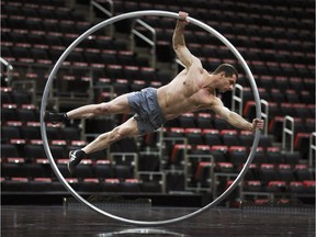 A Cirque Du Soleil performer works inside a large acrobatic ring during a rehearsal for the show Corteo at the Little Caesars Arena in Detroit.  The show plays in Detroit twice on Saturday and twice on Sunday and will be at the WFCU Centre in Windsor from May 15 to 19.
