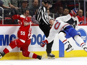 Detroit Red Wings defenseman Niklas Kronwall (55) checks Montreal Canadiens right wing Brendan Gallagher (11) in the third period of an NHL hockey game on Jan. 8, 2019, in Detroit.