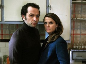 In this image released by FX, Matthew Rhys, left, and Keri Russell appear in a scene from "The Americans."