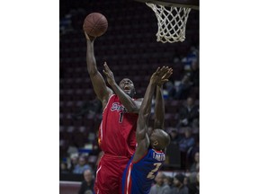 WINDSOR, ONT:. JANUARY 9, 2019 - Windsor's Juan Patillo takes a shot while Cape Breton's Olu Famutimi defends in NBLC action between the Windsor Express and the Cape Breton Highlanders at the WFCU Centre, Wednesday, January 9, 2019.