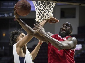 WINDSOR, ONT:. JANUARY 11, 2019 - Windsor's Juan Pattillo attempts a layup while Saint John's TJ Maston in NBLC action between the Windsor Express and the Saint John Riptide at the WFCU Centre, Friday, January 11, 2019.