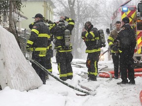 Windsor firefighters are shown on scene of a house fire in the 400 block of Parent Ave. on Saturday, January 19, 2019. The fire broke out around 10:30 a.m. and resulted in several occupants being displaced.