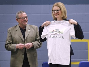 Several area organizations received money from the federal government on Jan. 25, 2019. Kate Young, Parliamentary Secretary to MP Carla Qualtrough, Minister of Public Services and Procurement and Accessibility made announcements at the YMCA of Western Ontario in Windsor and the Riverside Sports Centre. Bill Kell, Chair of the Riverside Minor Baseball Club and Co-Chair of the Farrow Riverside Miracle Park project presented a shirt to Young after she announced a grant of $100,000 to the club.