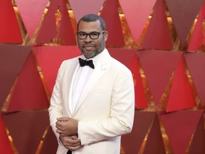 FILE - In this March 4, 2018 file photo, Jordan Peele arrives in Los Angeles. Peele's "Us," his anticipated follow-up to "Get Out," will make its world premiere at the South by Southwest Film Festival. SXSW announced Tuesday that "Us" will open the 26th edition of the Austin, Texas, festival on March 8. Like Peele's "Get Out," "Us" is a socially minded horror thriller.