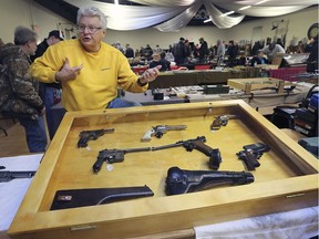 Mickey Moulder, vice-chairman of the Canadian Transportation Museum and Heritage Village is shown with his display of vintage guns during the Militaria, Hunting and Sportsman Show  on Sunday, January 13, 2019.