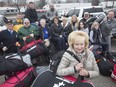 Kim Spirou, president of the Rotary Club of Essex, and leader of the Rotary Mission to Ghana, stands with other Rotarians and local volunteers with 53 hockey bags stuffed with items to be donated in Ghana on Jan. 15, 2019.