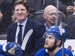 Toronto Maple Leafs head coach Mike Babcock, left, reacts as William Nylander, right, looks against the Nashville Predators during third period NHL hockey action in Toronto on Jan. 7, 2019.