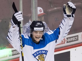 Finland's Rasmus Kupari celebrates his team's win over Switzerland following third period IIHF world junior semifinal hockey action in Vancouver on Jan. 4, 2019.