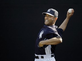 File-This Feb. 16, 2013, file photo shows New York Yankees' Mariano Rivera pitching during a workout at baseball spring training in Tampa, Fla. Rivera has become baseball's first unanimous Hall of Fame selection, elected along with Roy Halladay, Edgar Martinez and Mike Mussina. Rivera received all 425 votes in balloting by the Baseball Writers' Association of America. The quartet will be enshrined in Cooperstown along with Today's Game Era Committee selections Harold Baines and Lee Smith on July 21.