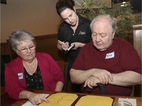 Sandy and Rick Amlin seated give their order Wednesday to Cramdon's Tap and Eatery server Cathy McAfrey during the first-ever Dining With Dementia. The program is a new co-operative effort with area restaurants that provides people with dementia a chance to go to a closed-off section of a restaurant with a caregiver.
