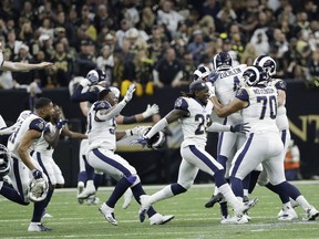 Los Angeles Rams players celebrate after overtime of the NFL football NFC championship game against the New Orleans Saints, Sunday, Jan. 20, 2019, in New Orleans.
