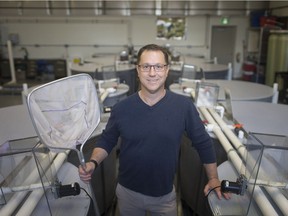 Trevor Pitcher, director at the Freshwater Restoration Ecology Centre, is pictured at the centre, Thursday, January 3, 2019.