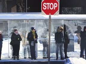 Transit Windsor commuters wait in the bitter cold on January 31, 2019 on University Ave. W. in Windsor. DAN JANISSE/WINDSOR STAR
