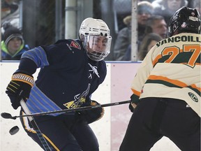 The Jr. C Outdoor Shinny Series game between the Amherstburg Admirals and Wallaceburg Lakers was held on Saturday, January 12, 2019, at the Lanspeary Park rink in Windsor, ON. Reid Stieler, left, of Amherstburg and Jake Vancoillie of Wallaceburg battle for the puck during the game.