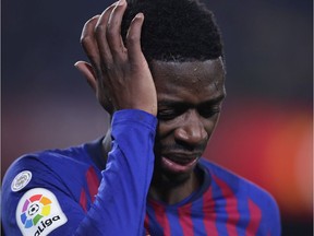 FC Barcelona's Dembele reacts after being injured during the Spanish La Liga soccer match between FC Barcelona and Leganes at the Camp Nou stadium in Barcelona, Spain, Sunday, Jan. 20, 2019.