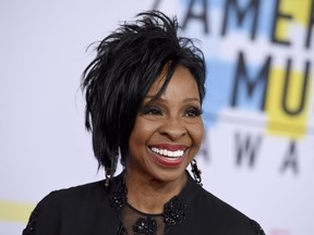 FILE - In this Oct. 9, 2018 file photo, Gladys Knight arrives at the American Music Awards at the Microsoft Theater in Los Angeles. The seven-time Grammy Award-winner will sing "The Star-Spangled Banner" at this year's Super Bowl, Sunday, Feb. 3, 2019.  Knight says she's proud to use her voice to "unite and represent our country" in her hometown of Atlanta.