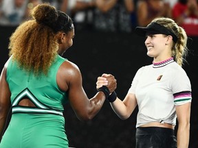 Serena Williams of the US (L) shakes hands with Canada's Eugenie Bouchard after winning their women's singles match on day four of the Australian Open tennis tournament in Melbourne on January 17, 2019.