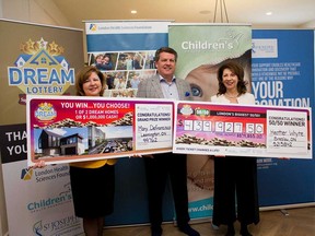 Leamington resident Mary Defrancisco (left) with John MacFarlane, president of the London Health Sciences Centre Foundation, and Heather Whyte, who won the Dream Lottery's 50/50 draw, on Jan. 10, 2019.