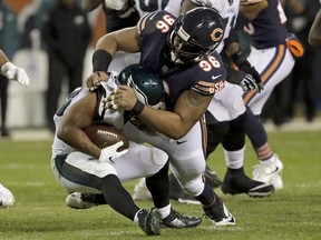 Chicago Bears defensive end Akiem Hicks (96) tackles Philadelphia Eagles running back Darren Sproles (43) during the second half of an NFL wild-card playoff football game Sunday, Jan. 6, 2019, in Chicago. (AP Photo/Nam Y. Huh)