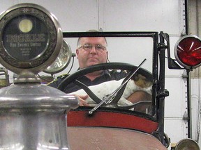 Former Kingsville fire chief Bob Kissner sits at the wheel of a 1928 fire truck in this September 2010 file photo.