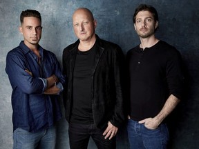 In this Jan. 24, 2019, file photo Wade Robson, from left, director Dan Reed and James Safechuck pose for a portrait to promote the film "Leaving Neverland" at the Salesforce Music Lodge during the Sundance Film Festival in Park City, Utah. Michael