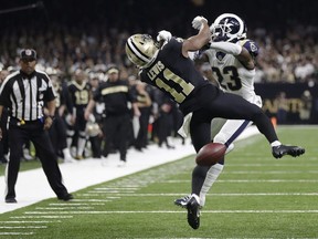 New Orleans Saints wide receiver Tommylee Lewis works for a coach against Los Angeles Rams defensive back Nickell Robey-Coleman during the second half the NFL football NFC championship game Sunday, Jan. 20, 2019, in New Orleans. The Rams won 26-23.