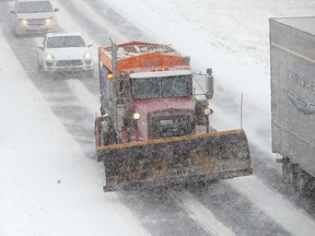 A snow plow travels on Windsor's E.C. Row Expressway near Dominion Boulevard on Jan. 28, 2019.