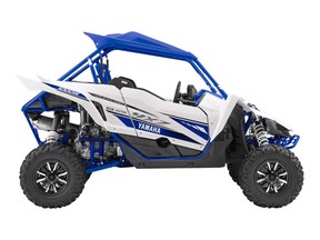 A 2017 Yamaha YXZ1000R two-seat side-by-side all-terrain recreation vehicle is shown in this promotional image by the manufacturer.