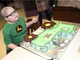 Huntre Allard with his custom-made tractor cake at Our Lady of Perpetual Help Catholic Elementary School Monday February 11, 2019. A fundraiser is being held for Huntre and his family on March 23 at 5 pm at the Royal Canadian Legion, Branch 143, 1570 Marentette Ave. Tickets can be obtained by phoning 226-344-9476