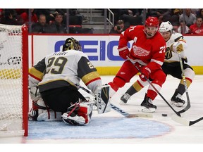 Dylan Larkin #71 of the Detroit Red Wings tries to get a shot off on Marc-Andre Fleury #29 of the Vegas Golden Knights during the second period at Little Caesars Arena on February 07, 2019 in Detroit, Michigan.
