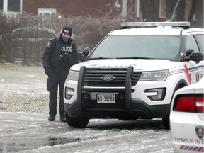 A Windsor police officer at a residence in the 1500 block of Arthur Road where multiple units responded to information about a possible firearm on Feb. 12, 2019.