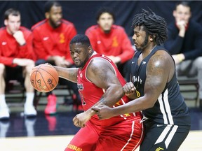 Windsor, Ontario. February 13, 2019 -  Windsor Express Deandre Thomas tangles with Sudbury Five Isaiah Johnson in NBL Canada action from WFCU Centre Wednesday.