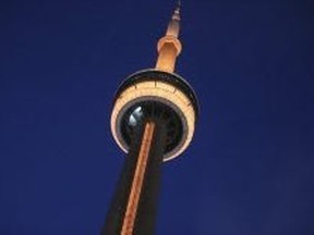 The CN Tower was flooded in gold light on Feb. 11, 2019. (Veronica Henri, Toronto Sun)