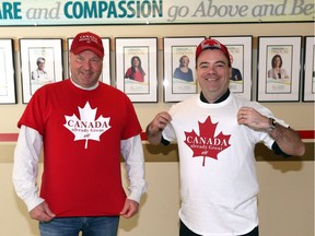Kurt Reffle, left, and Steve Erwin of Windsor Regional Hospital Ouellette Avenue Campus model caps and T-shirts from Canada already Great, eh! a non-profit group raising funds for local charities. Volunteers Reffle and Brenda Scott (not shown) have a display table set up Windsor Regional Hospital and funds collected will support 12 local organizations which including Amherstburg Goodfellows, Brentwood, Belle Vue, Secret Santa and others.