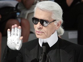 German designer Karl Lagerfeld acknowledges the public at the end Chanel Fall-Winter 2009 Haute Couture collection show in Paris on July 1, 2008.