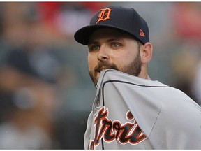 In this Sept. 3, 2018, file photo, Detroit Tigers' Michael Fulmer leaves the game after getting hit by a ball hit by Chicago White Sox's Daniel Palka during a baseball game in Chicago. Detroit beat pitcher Michael Fulmer in the final salary arbitration case this year, leaving players with a 6-5 final record in decisions. Fulmer was awarded a raise from $575,200 to $2.8 million. Fulmer had asked for $3.4 million.