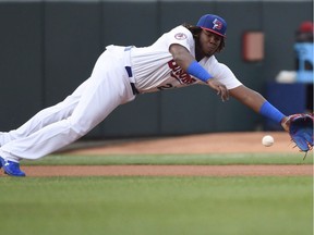 Buffalo Bisons third baseman Vladimir Guerrero Jr. (27) dives for the ball during triple-A baseball action in Buffalo on July 31, 2018.