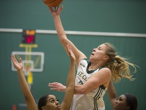 WINDSOR, ONT:. FEBRUARY 22, 2019 - St. Clair's Kim Moroun takes a shot over Seneca defenders in OCAA girls basketball playoffs between the St. Clair Saints and the Seneca Sting at the SportsPlex, Saturday, February 23, 2019.