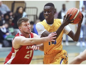 WINDSOR, ON. February 17, 2019. --   Josh Lalonde, left, of Brennan pressures Mazin Tiea of Kennedy during their game on Sunday, February 17, 2019, at St.Clair College.