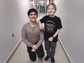 Big Brothers Big Sisters Windsor Essex received $35,000 from RBC Royal Bank on Thursday, February 14, 2019 for the RBC Teen Mentoring program. Teen mentor Jamiel, 17, is shown with mentee Louis, 12, during a press conference at Herman Secondary School.