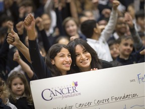 Proud baker. Tala Hilal, 12, a Grade 5 student at Windsor's Academie Ste. Cecile International School, poses on Feb. 1, 2019, with Houida Kassem, executive director of the Windsor Cancer Centre Foundation, after donating $3,000 she raised from baking cakes.