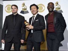 Jason Cole, from left, Hiro Murai and Ibra Ake pose in the press room with the award for best music video for Childish Gambino's "This Is America" at the 61st annual Grammy Awards at the Staples Center on Sunday, Feb. 10, 2019, in Los Angeles.