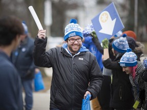 Participants get a cheerful sendoff for the Coldest Night of the Year walk outside the Downtown Mission, Saturday, February 23, 2019.
