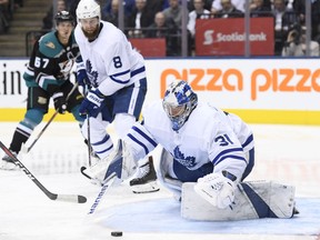 Toronto Maple Leafs goaltender Frederik Andersen (31) covers up the puck as defenceman Jake Muzzin (8) looks on during third period NHL hockey action against the Anaheim Ducks in Toronto on Monday, February 4, 2019.