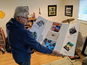Retired Windsor Star reporter Don Lajoie holds the display board he uses to teach people about Haitian-made Surtab computer tablets. With help from local charity Hearts Together for Haiti, Lajoie, shown here at his Windsor home on Feb. 8, 2019, hopes to get more tablets in the hands of school children in the country, improving the quality of their education in an impoverished country.