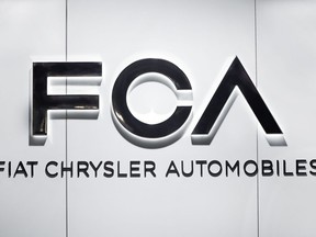 FILE - In this Monday, Jan. 14, 2019 file photo, Fiat Chrysler Automobiles FCA logo is shown at the North American International Auto Show in Detroit. Shares in Italian American automaker Fiat Chrysler have tanked Thursday, Feb. 7 after the company issued conservative earnings forecasts for 2019. Fiat Chrysler shares were temporarily suspended from trading due to excessive volatility, and then shed 11 percent in Milan.