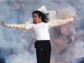 This Feb. 1, 1993, file photo shows Pop superstar Michael Jackson performing during the halftime show at the Super Bowl in Pasadena, Calif. A stage musical about Jackson will now skip making its debut in Chicago and instead open Broadway in summer 2020. Producers said Feb. 14 that "Don't Stop 'Til You Get Enough" will no longer have pre-Broadway performances this fall in Chicago, blaming a recent Actors' Equity strike over compensation for developmental labs.
