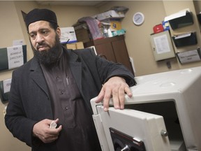 Mohamed Al-Jammali, imam of the Windsor Islamic Association, shows the safe that Windsor police recovered after a break-in at the mosque on Northwood Street on the morning of Feb. 4, 2019.